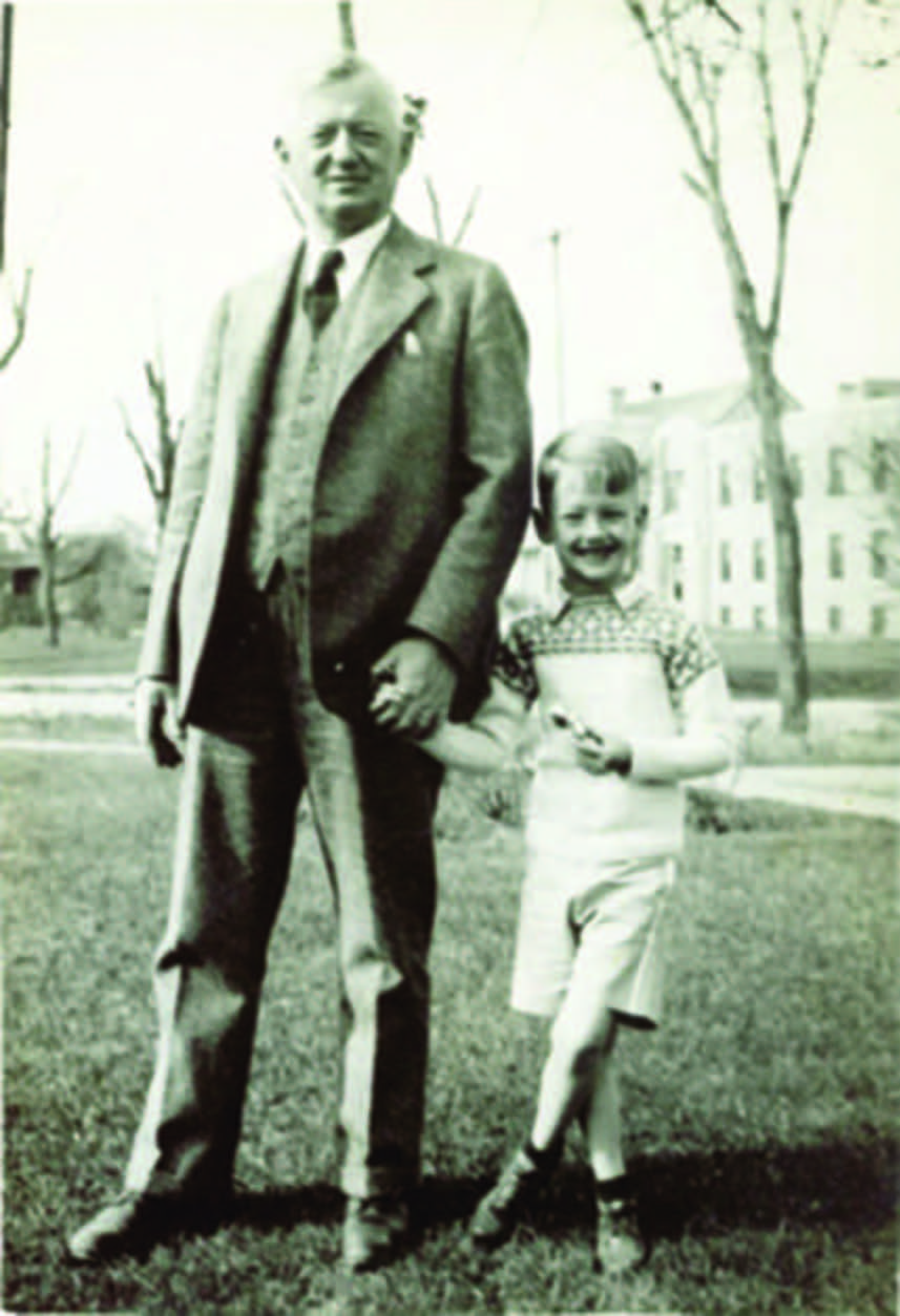 Historic black-and-white photo of a senior man walking with a child - retirement communities